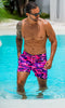 mens pink swim trunks in the pool